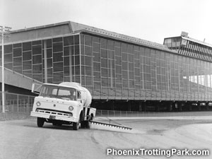 Water Truck spraying down the track